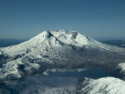 Mount St. Helens rises above Spirit Lake in this aerial view taken on Tuesday.