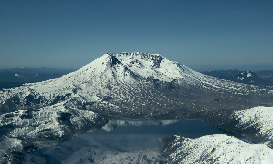 Mount St. Helens rises above Spirit Lake in this aerial view taken on Tuesday.