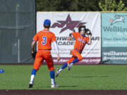 Ridgefield center fielder Reed Fry can'it quite corral a fly ball in the first inning on Tuesday, May 4, 2021, at the Ridgefield Outdoor Recreation Complex. Columbia River won 4-2 to advance in the 2A Southwest District Tournament.