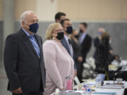 Don Benton, left, joins others as they stand while prospective jurors enter the room during the lawsuit trial Tuesday afternoon at the Clark County Event Center at the Fairgrounds.