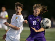 Columbia River'is Greer Snellman battles for a ball with an Aberdeen defender in a 2A Southwest District boys soccer semifinal on Thursday, May 6, 2021, at Columbia River High School. The Rapids topped Aberdeen 2-0 to advance to Saturday'is championship game against Tumwater.