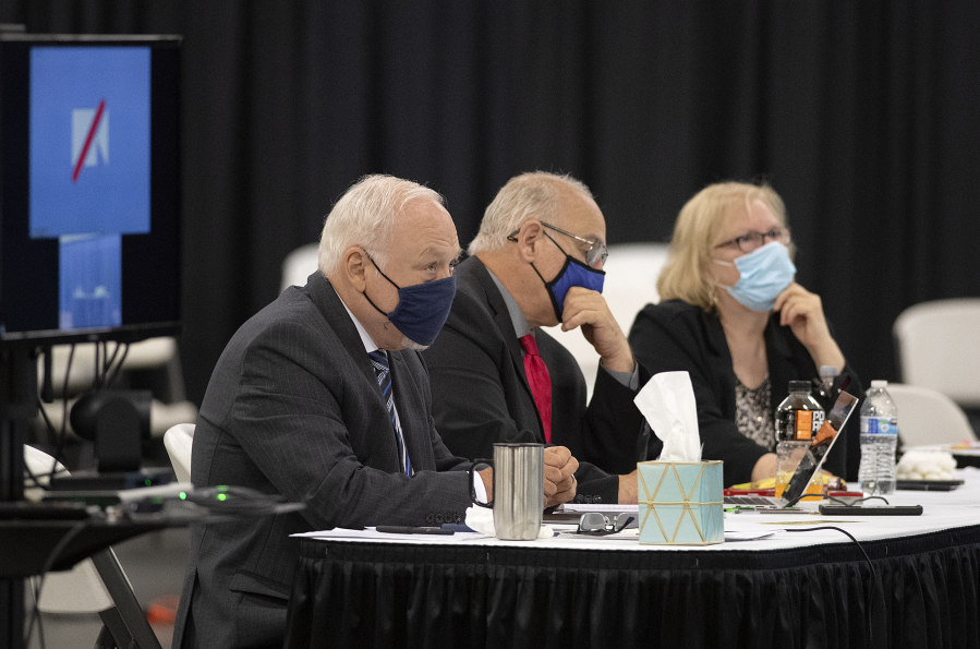 Plaintiffs Don Benton, from left, Christopher Clifford and Susan Rice wait to hear testimony Monday from former Clark County manager Mark McCauley in the trial for a lawsuit brought by them, at the Clark County Event Center at the Fairgrounds.