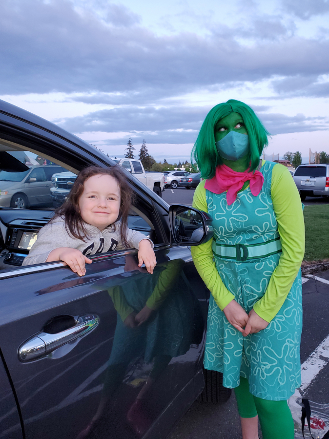 BATTLE GROUND: The character Disgust from the movie "Inside Out" visited with families at a drive-in movie event on May 7.