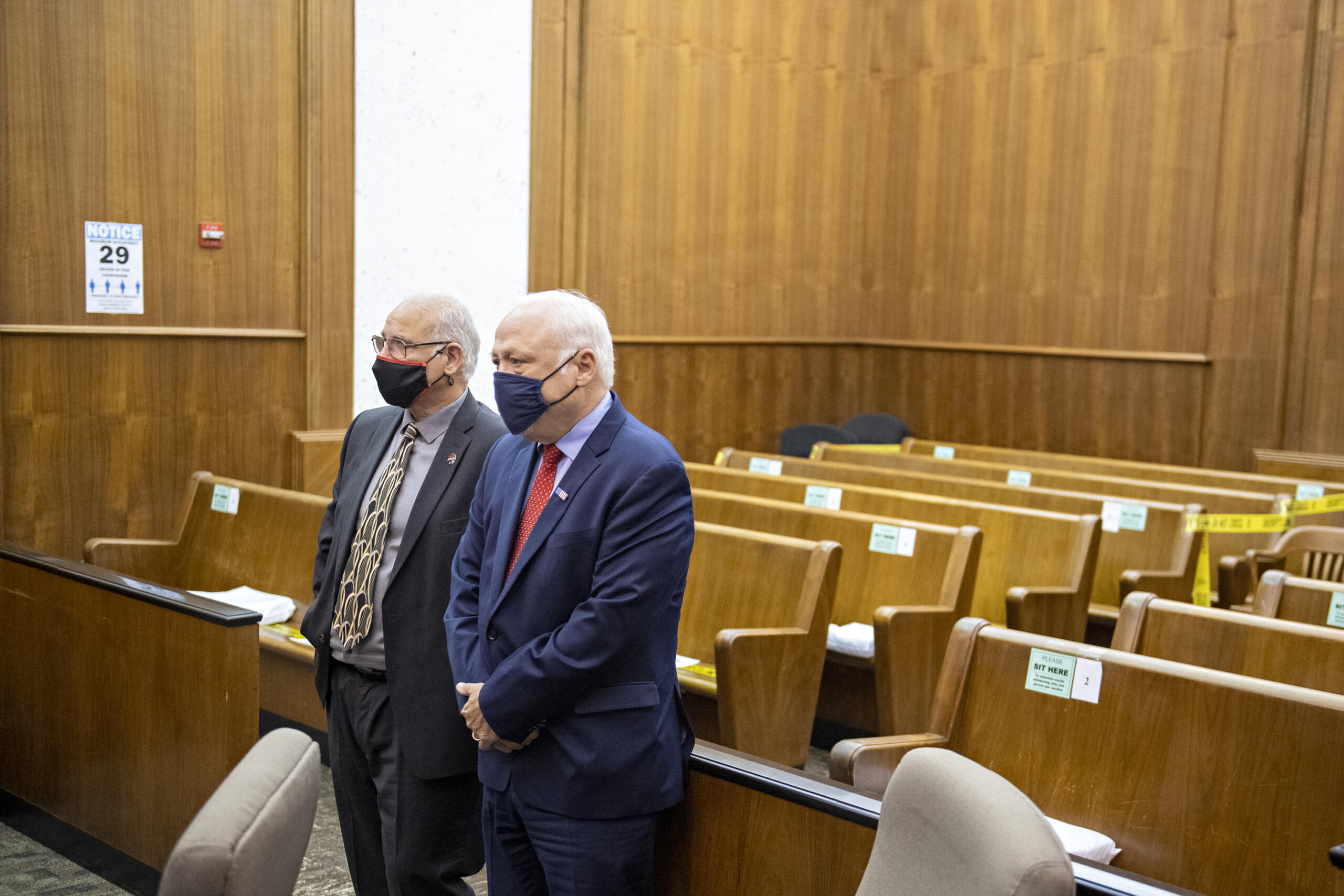 Plaintiffs Christopher Clifford, left, and Don Benton stand after the verdict in their lawsuit trial in a nearly empty courtroom at the Clark County Courthouse on Thursday morning, May 20, 2021.