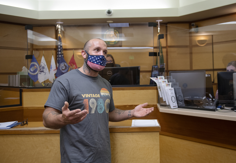 Veteran Joshua Kenney gives an emotional thank you to those who helped him during his time in the Veterans Therapeutic Court while taking part in the program's commencement ceremony May 24 at the Clark County Courthouse.