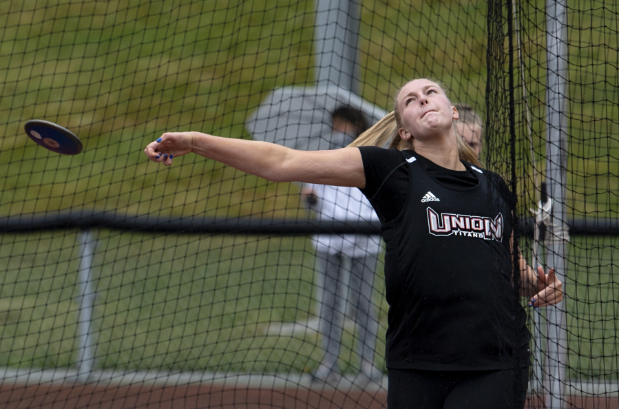 Union junior Ariel Ammentorp throws the discus in a 4A/3A Greater St. Helens League dual on Tuesday, May 25, 2021, at Union High School. Ammentorp, a three-sport athlete, quickly took a liking to the hammer throw last summer and now garners college interest from Arizona, USC and Army.