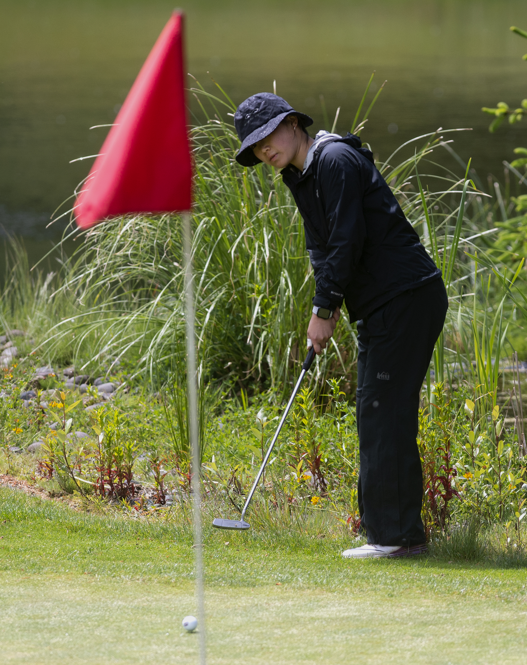Union’s Jade Gruher putts from the fringe on the 17th hole in the 4A/3A district girls golf championships on Thursday, May 27, 2021, at Lewis River Golf Course in Woodland. Union sophomore Jade Gruher won the 4A title with a 76-77-185 total over two days. Kelso senior Liz Dolan scored a 74-80-186 to win the 3A title.