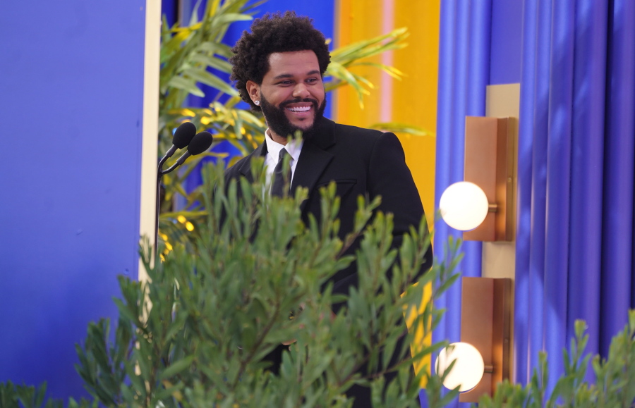 The Weeknd accepts the top hot 100 album award at the Billboard Music Awards on Sunday, May 23, 2021, at the Microsoft Theater in Los Angeles.