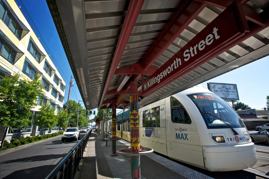 A northbound Yellow Line Max train, left, stops at the Killingsworth station in Portland, and an articulated hybrid bus, right, of the type used on C-Tran's bus rapid transit route, The Vine, is seen in Vancouver.  The question of whether TriMet's Yellow Line should be extended to Vancouver was a key point of contention during development of the Columbia River Crossing project and is often cited as one of the main disagreements that derailed the project. The current renewed replacement effort will consider both light rail and bus rapid transit options to meet the project's high-capacity transit needs, and no decision has been made yet - but recent comments from federal lawmakers pushed the still-simmering disagreement back into the spotlight.