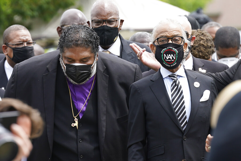 Rev. William Barber II, left and Rev. Al Sharpton arrive for the funeral for Andrew Brown Jr., Monday, May 3, 2021 at Fountain of Life Church in Elizabeth City, N.C. Brown was fatally shot by Pasquotank County Sheriff deputies trying to serve a search warrant.
