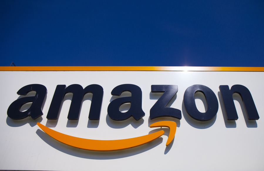 FILE - In this April 16, 2020, file photo, the Amazon logo is displayed in Douai, northern France.  Amazon said Tuesday, May 18, 2021,  that it will continue to ban police use of its face-recognition technology beyond the one-year ban it announced last year.
