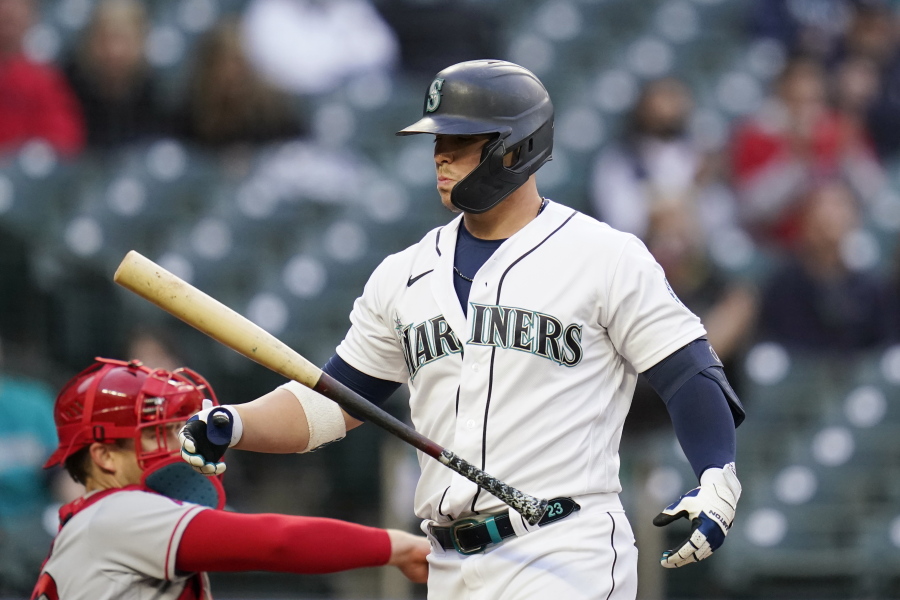 Seattle Mariners' Ty France walks away from the plate after striking out against the Los Angeles Angels during the third inning of a baseball game Saturday, May 1, 2021, in Seattle.