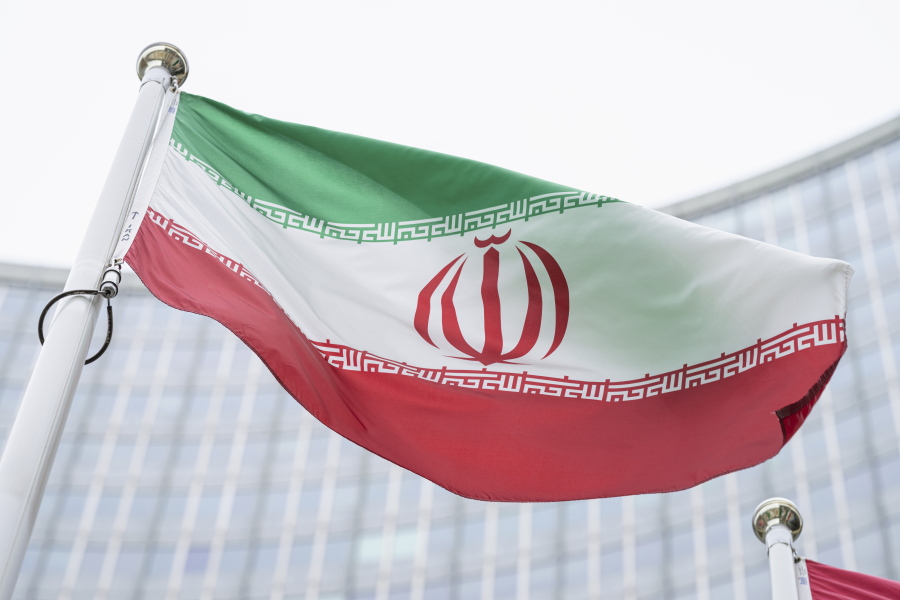 FILE - In this Monday, May 24, 2021 file photo, the flag of Iran waves in front of the the International Center building with the headquarters of the International Atomic Energy Agency, IAEA, in Vienna, Austria, Monday, May 24, 2021.  The United Nations' International Atomic Energy Agency watchdog reported Monday May 31, 2021, it hasn't been able to access data important to monitoring Iran's nuclear program since late February when the Islamic Republic started restricting international inspections of its facilities.