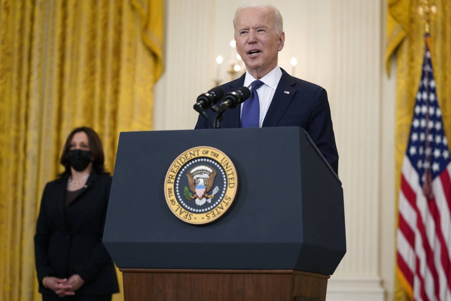 Vice President Kamala Harris, left, listens as President Joe Biden speaks about the economy, in the East Room of the White House, Monday, May 10, 2021, in Washington.