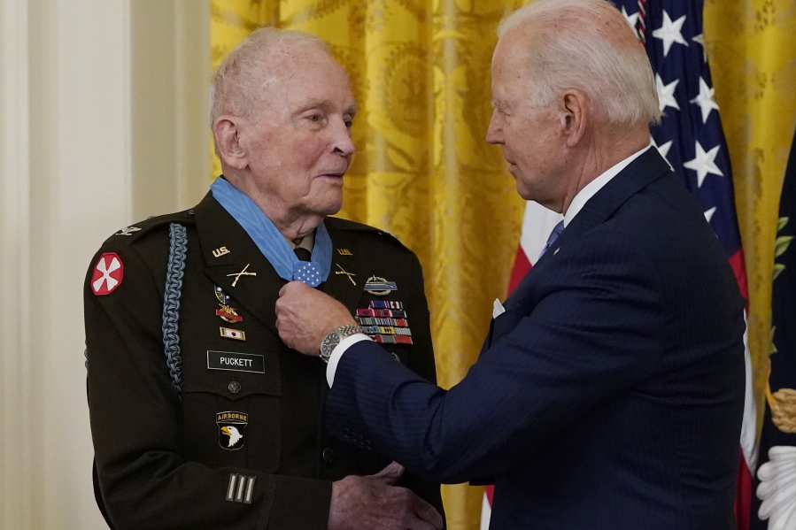 President Joe Biden speaks with retired U.S. Army Col. Ralph Puckett after he was presented the Medal of Honor, in the East Room of the White House, Friday, May 21, 2021, in Washington.