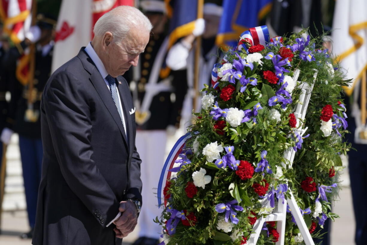 President Joe Biden pauses after placing a wreath at the Tomb of the Unknown Soldier at Arlington National Cemetery on Memorial Day on Monday in Arlington, Va.