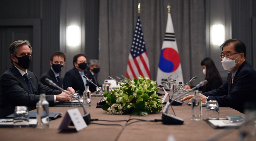 United States Secretary of State Antony Blinken, left, wearing a face mask to curb the spread of coronavirus, speaks to South Korea's Foreign Minister Chung Eui-yong, right, during bilateral talks on the sidelines of a G7 foreign ministers meeting, at the Grosvenor House Hotel, London, Monday, May 3, 2021.