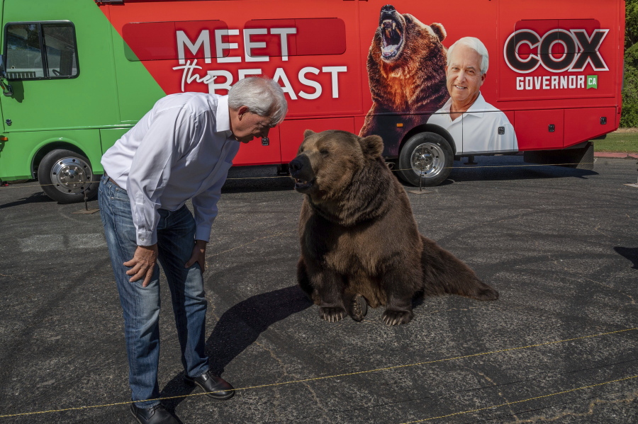 John Cox, Republican recall candidate for California governor, begins his statewide "Meet the Beast" bus tour on Tuesday, May 4, 2021, with Tag, a Kodiak brown bear, at Miller Regional Park in Sacramento. (Renee C.