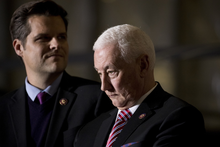 FIL E- In this Dec. 20, 2019, file photo Rep. Matt Gaetz, R-Fla., left, and Rep. Greg Pence, R-Ind., right, arrive before President Donald Trump signs the National Defense Authorization Act for Fiscal Year 2020 at Andrews Air Force Base, Md. In one of the most chilling scenes from the Jan. 6 insurrection, a violent mob surged through the halls of the U.S. Capitol chanting "hang Mike Pence." But when the House moved this week to create an independent commission to investigate the tragedy, the former vice president's brother voted no.