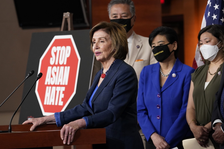 House Speaker Nancy Pelosi of Calif., left, speaks during a news conference on Capitol Hill in Washington, Tuesday, May 18, 2021, on the COVID-19 Hate Crimes Act. Pelosi is joined by Rep. Mark Takano, D-Calif., second from left, Rep. Judy Chu, D-Calif., second from right and Rep. Grace Meng, D-N.Y.