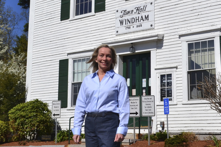 In this May 7, 2021 photo, Kristi St. Laurent, who ran for a House seat in the 2020 election, poses in front of Town Hall in Windham, N.H. St. Laurent, who requested a recount after losing the 2020 election by 24 votes, has led to a debate over the integrity of the election in Windham and prompted Trump supporters to suggest the dispute could illustrate wider problems with the election system.