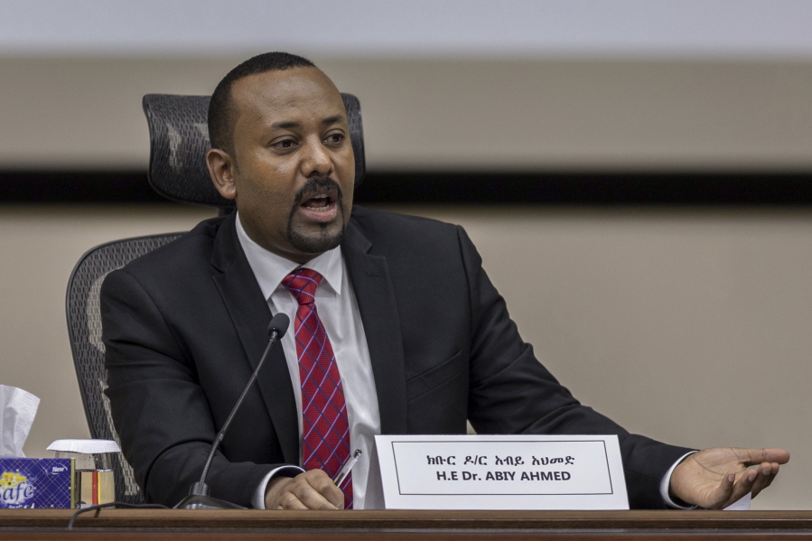 FILE - In this Monday, Nov. 30, 2020 file photo, Ethiopia's Prime Minister Abiy Ahmed responds to questions from members of parliament at the prime minister's office in the capital Addis Ababa, Ethiopia. Ethiopia has again delayed its national election after the head of the national elections board, Birtukan Mideksa, in a meeting with political parties' representatives on Saturday, May 15, 2021 said the June 5 vote in Africa's second most populous country would be postponed until a yet-unknown date.
