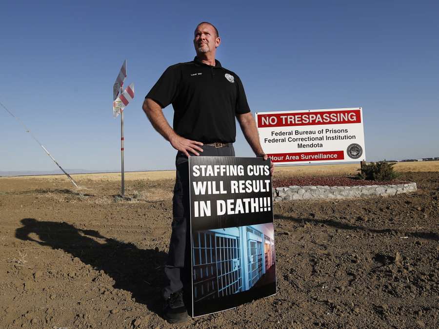 Aaron McGlothin, union president at the Federal Correctional Institution at Mendota, poses for a photo while leading a protest against staffing shortages, near the prison entrance in Mendota, Calif., Monday, May 17, 2021.