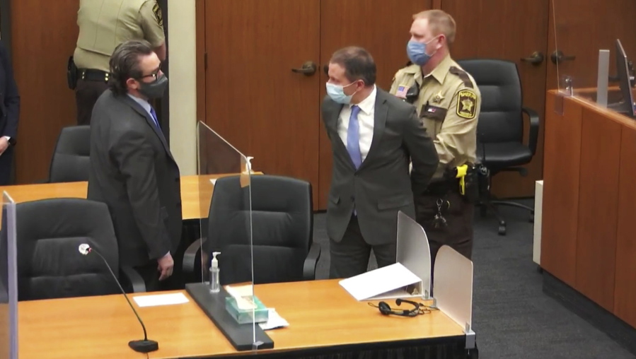 FILE - In this April 20, 2021 file image from video, former Minneapolis police Officer Derek Chauvin, center, is taken into custody as his attorney, Eric Nelson, left, looks on, after the verdicts were read at Chauvin's trial for the 2020 death of George Floyd, at the Hennepin County Courthouse in Minneapolis, Minn. In a ruling May 12, 2021, Judge Cahill finds aggravating factors in death of George Floyd, paving way for tougher sentence for Chauvin.