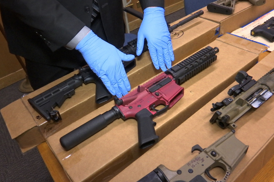 FILE - In this file photo taken Wednesday, Nov. 27, 2019, is Sgt. Matthew Elseth with "ghost guns" on display at the headquarters of the San Francisco Police Department in San Francisco. A federal appeals court in San Francisco has ruled that plans for 3D-printed, self-assembled "ghost guns" can be posted online without U.S. State Department approval. The San Francisco Chronicle says the 2-1 decision was made Tuesday, April 27, 2021, by the 9th U.S. District Court of Appeals.