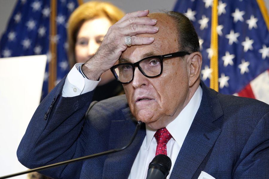 FILE - In this Nov. 19, 2020, file photo, former New York Mayor Rudy Giuliani, who was a lawyer for President Donald Trump, speaks during a news conference at the Republican National Committee headquarters in Washington. U.S. prosecutors in 2019 sought the electronic messages of two ex-Ukrainian government officials and a Ukrainian businessman as part of their probe of Rudolph Giuliani's dealings in that country, a lawyer accidentally revealed in a court filing Tuesday, May 25, 2021. The filing said federal prosecutors in New York had obtained an email account believed to belong to the former prosecutor general of Ukraine, Yuriy Lutsenko.
