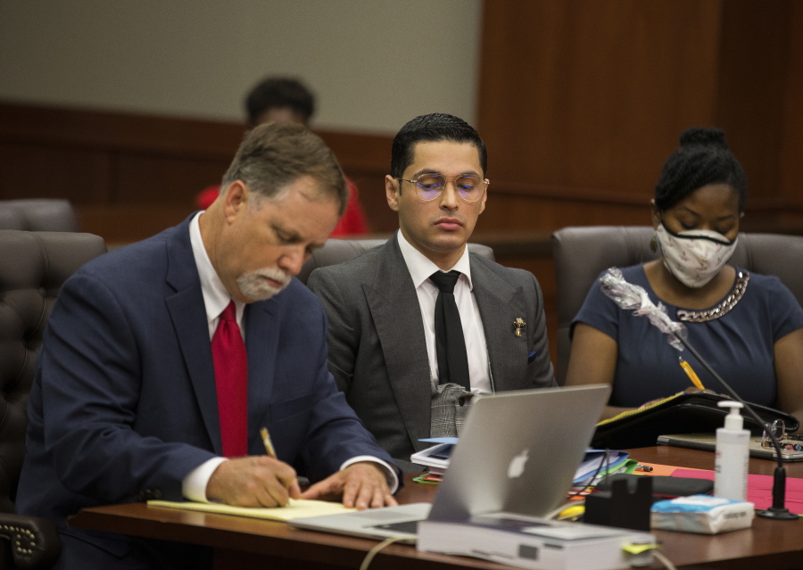 Attorney Michael Elliott and his client Victor Hugo Cuevas, a 26-year-old linked to a missing tiger named India, attend a bond revocation hearing on a separate murder charge at Fort Bend County Justice Center on Friday, May 14, 2021, in Richmond, Texas. (Godofredo A.