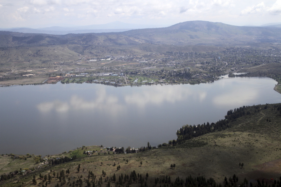 FILE - This May 7, 2013 file photo shows Klamath Falls, in Ore. on the far side of Upper Klamath Lake. A federal judge has ruled against the Klamath Tribes in a lawsuit that accuses the U.S. Bureau of Reclamation of violating the Endangered Species Act by letting water levels fall too low for sucker fish to spawn in a key lake that also feeds an elaborate irrigation system along the Oregon-California border. The ruling, reported Friday, May 7, 2021, by the Herald and News in Klamath Falls, comes as the region confronts one of the driest years in memory.