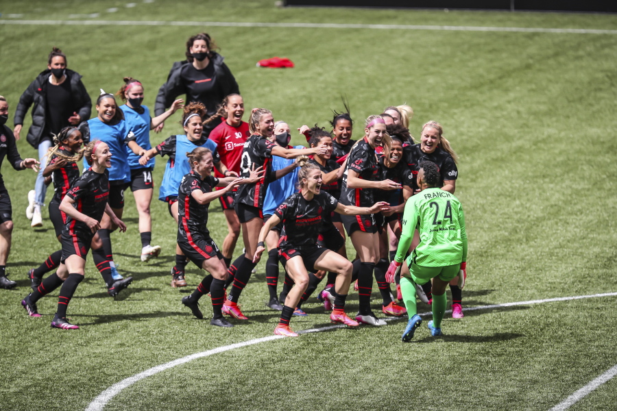 Portland Thorns goalkeeper AD Franch (24) joins the celebration after defeating NJ/NY Gotham FC in the NWSL Challenge Cup soccer final against NJ/NY Gotham FC at Providence Park, Saturday, May 8, 2021, in Portland, Ore.