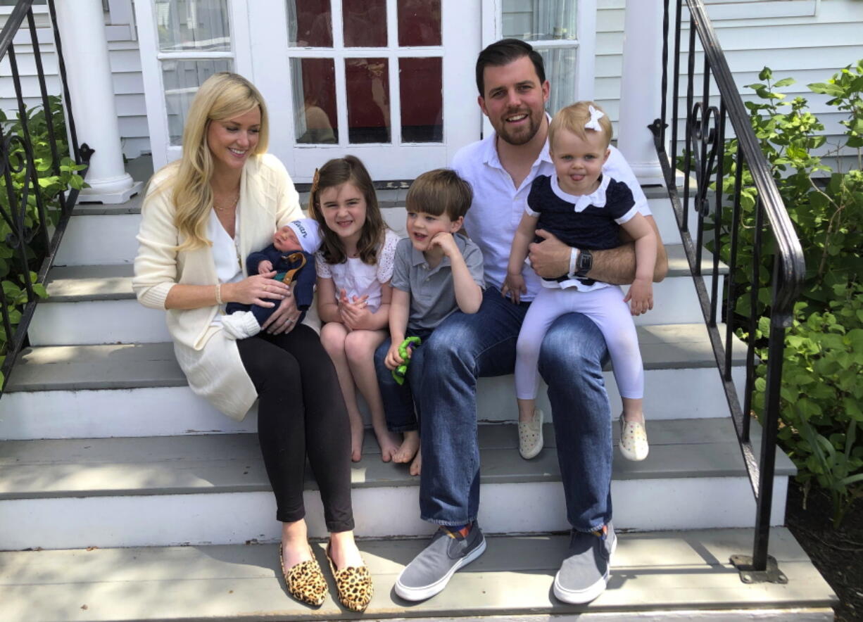 Caitrin O'Sullivan Boury, 36, left, with her husband, AJ, 35, and their four children, from left to right, Sullivan, Declyn, 5, Drew, 4, and Felicity, 2, on the steps of their home in Red Bank, N.J. on May 2. Caitrin faced challenges introducing her kids to her youngest, who was born during the pandemic.