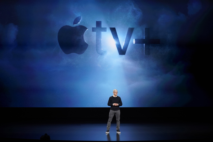 FILE - In this Monday, March 25, 2019, file photo, Apple CEO Tim Cook speaks at the Steve Jobs Theater during an event to announce new products, including Apple's steaming TV, in Cupertino, Calif. Streaming services ranging from Netflix to Amazon to Disney+ and others want us to stop sharing passwords. That's the new edict from the giants of streaming media, who are looking to discourage the common practice of sharing account passwords without alienating subscribers who've grown accustomed to the hack.
