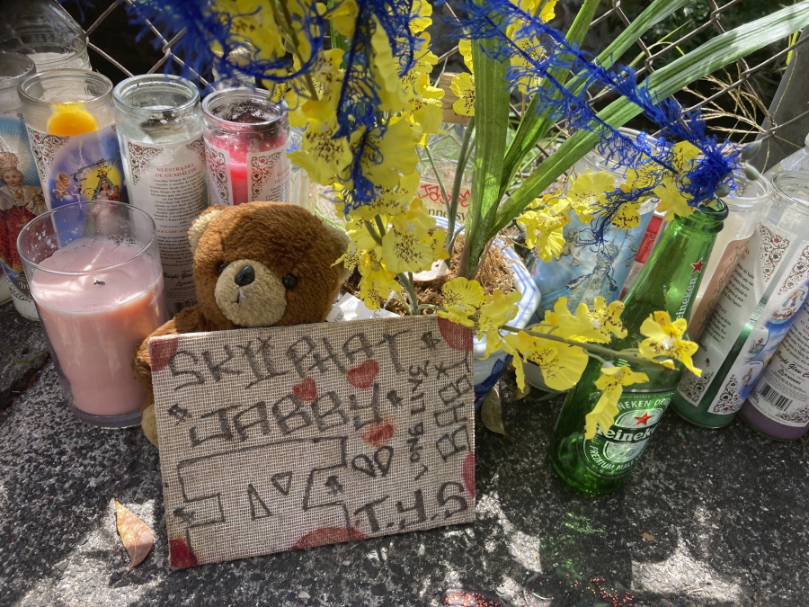 In this Wednesday, April 28, 2021, photo a stuffed bear is among the items left at a street memorial where Honolulu Police shot and killed 16-year-old Iremamber Sykap, whose nickname was Baby, during a car chase on Kalakaua Ave., in Honolulu. Some in Hawaii's Micronesian community say the shooting highlights the racism they face.
