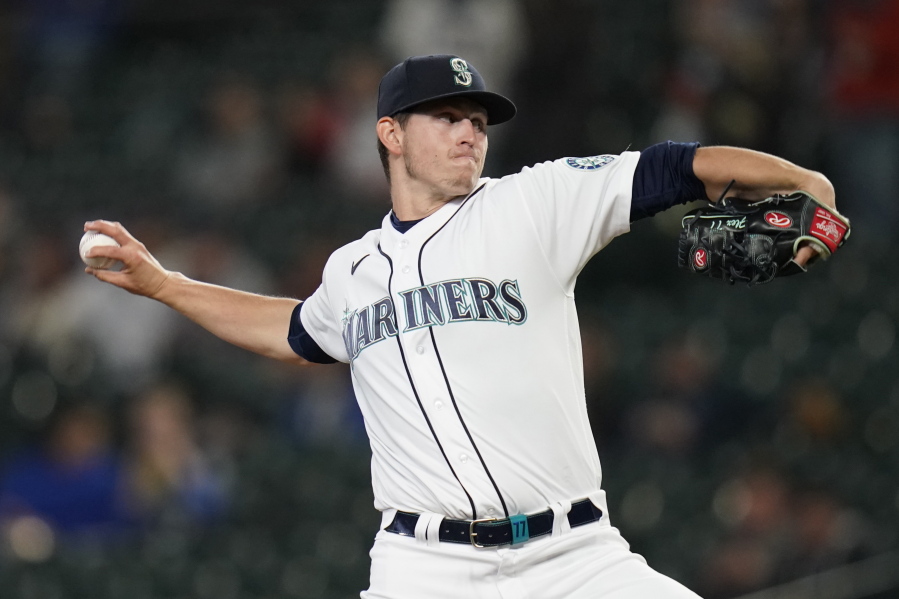 Seattle Mariners starting pitcher Chris Flexen throws to a Texas Rangers batter during the first inning of a baseball game Thursday, May 27, 2021, in Seattle.