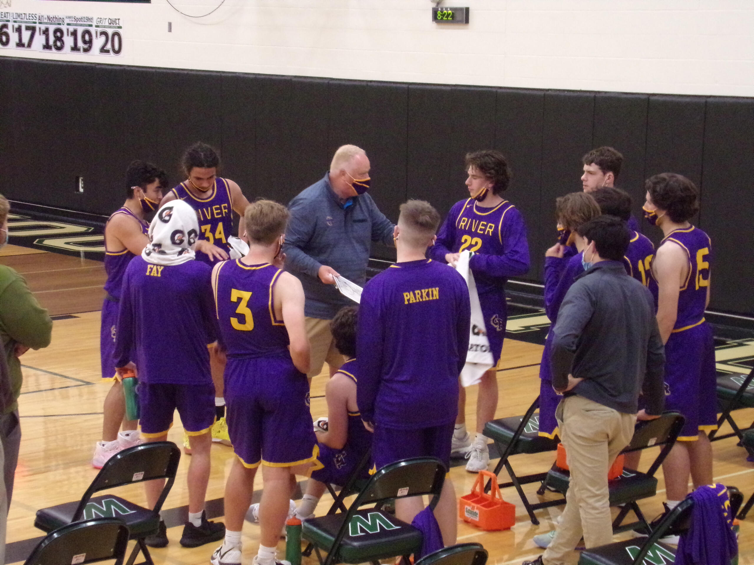 Columbia River coach David Long instructs Jacob Ayers (22) during a timeout in River's 57-43 win over Woodland on Tuesday, May 18, 2021 (Tim Martinez/The Columbian)