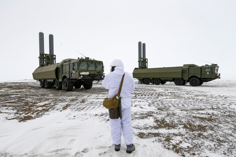 An officer speaks on walkie-talkie as the Bastion anti-ship missile systems take positions on the Alexandra Land island near Nagurskoye, Russia, Monday, May 17, 2021. Bristling with missiles and radar, Russia's northernmost military base projects the country's power and influence across the Arctic from a remote, desolate island amid an intensifying international competition for the region's vast resources. Russia's northernmost military outpost sits on the 80th parallel North, projecting power over wide swathes of Arctic amid an intensifying international rivalry over the polar region's vast resources.