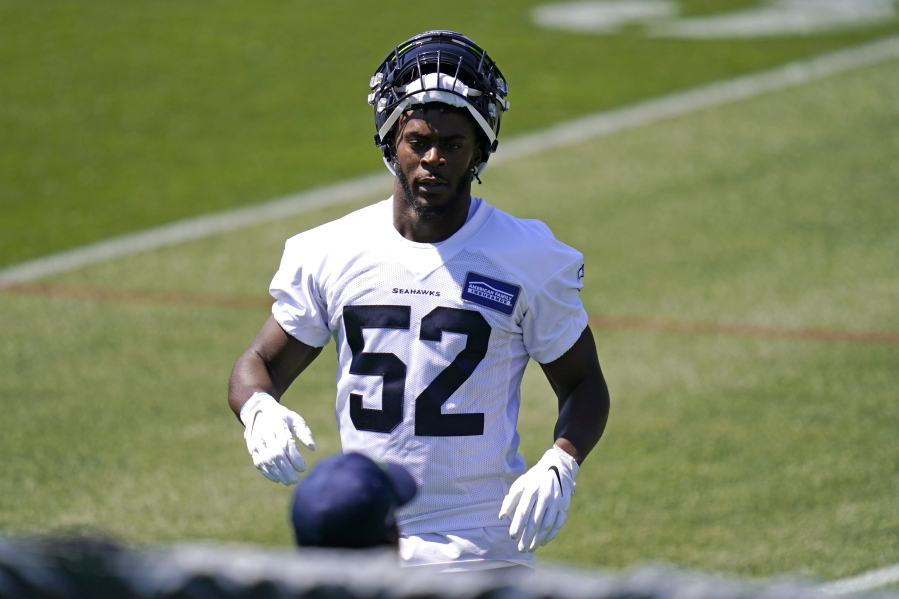 Seattle Seahawks' Darrell Taylor looks on during an NFL football rookie minicamp Friday, May 14, 2021, at the team's training facility in Renton, Wash.