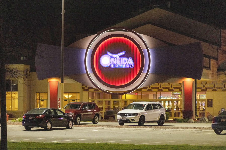 The Oneida Casino lights glow in the parking lot in the early morning hours of Sunday, May 2nd, 2021, near Green Bay, Wisconsin. Authorities in Wisconsin say a gunman killed two people at a Green Bay casino restaurant and seriously wounded a third before he was shot and killed by police Saturday.