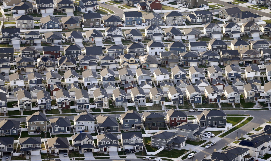 FILE - Rows of homes, are shown in suburban Salt Lake City, on April 13, 2019. Utah is one of two Western states known for rugged landscapes and wide-open spaces that are bucking the trend of sluggish U.S. population growth. The boom there and in Idaho are accompanied by healthy economic expansion, but also concern about strain on infrastructure and soaring housing prices.