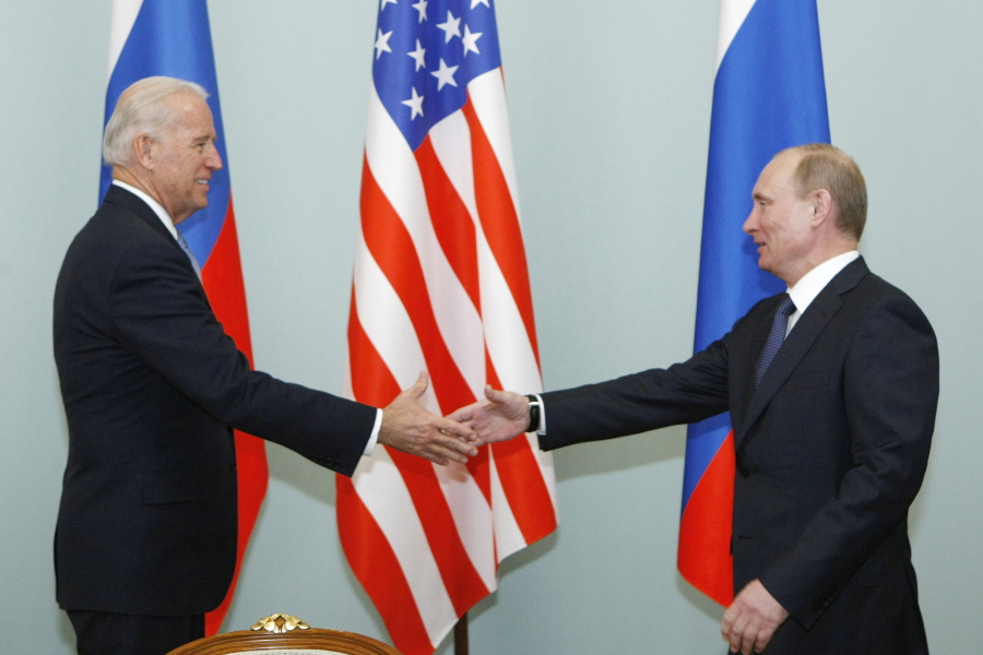 FILE - In this March 10, 2011, file photo, then Vice President Joe Biden, left, shakes hands with Russian Prime Minister Vladimir Putin in Moscow, Russia. President Joe Biden will hold a summit with Vladimir Putin next month in Geneva, a face-to-face meeting between the two leaders that comes amid escalating tensions between the U.S. and Russia in the first months of the Biden administration.