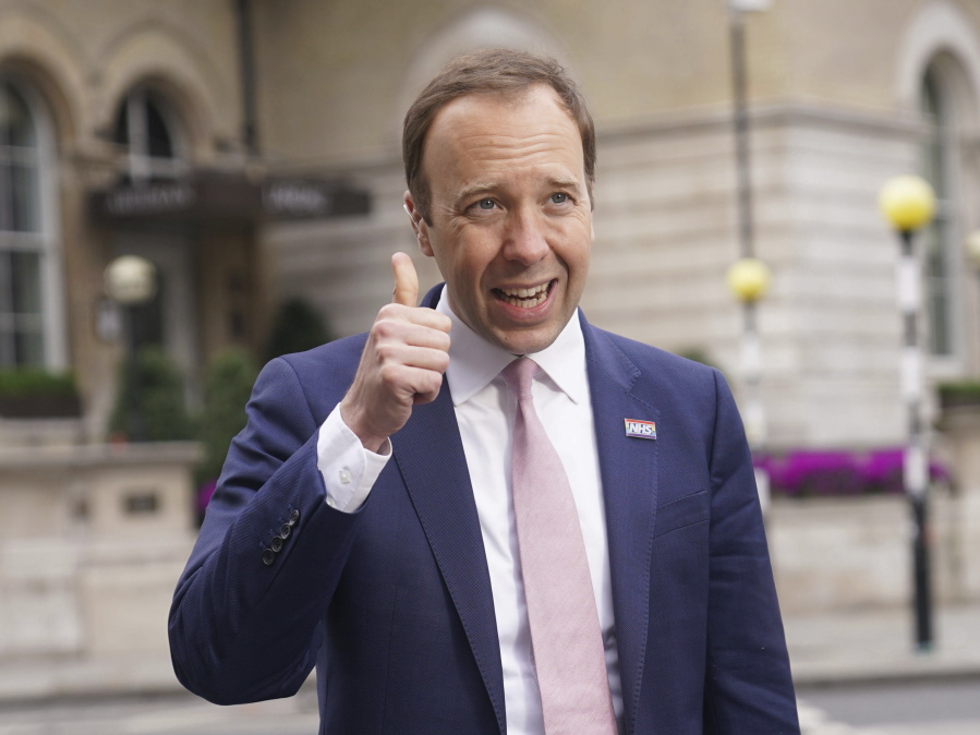 Britain's Health Secretary Matt Hancock gestures as he arrives at BBC Broadcasting House for his appearance on the current affairs programme, The Andrew Marr Show, in London, Sunday May 16, 2021. Cases of a virus variant first identified in India have more than doubled in a week, defying a sharp nationwide downward trend in infections won by months of restrictions and a rapid vaccination campaign.