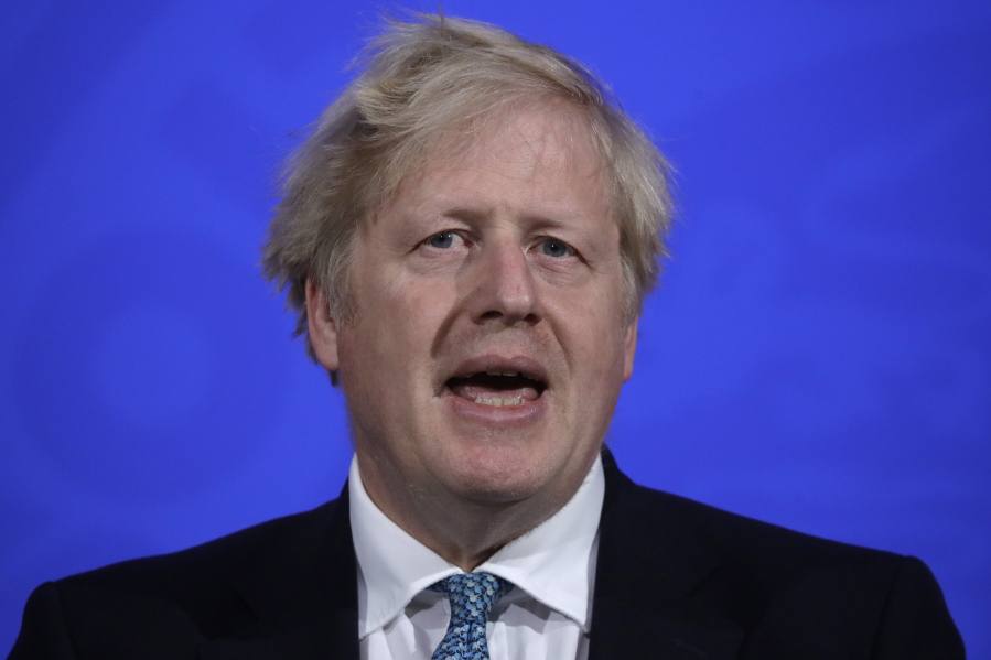 Britain's Prime Minister Boris Johnson speaking at a press conference about the ongoing coronavirus outbreak, in London, Friday, May 14, 2021.