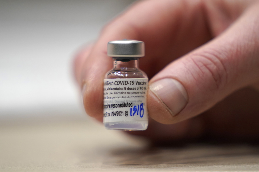 FILE - This Jan. 24, 2021, file photo shows a vial of the Pfizer vaccine for COVID-19 in Seattle. U.S. regulators on Monday, May 10, 2021, expanded use of Pfizer's shot to those as young as 12, sparking a race to protect middle and high school students before they head back to class in the fall. (AP Photo/Ted S.
