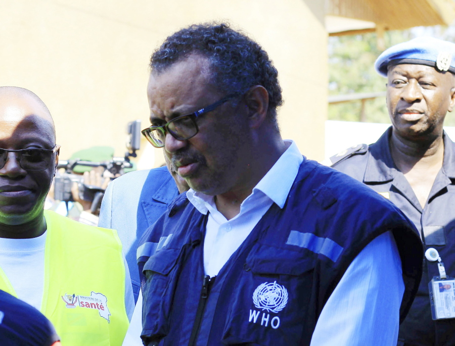 FILE - In this file photo dated Friday, Aug. 10, 2018, Dr. Tedros Adhanom Ghebreyesus, WHO Director General, speaks to a health official at a newly established Ebola response center in Beni, Democratic Republic of Congo. British, European and American diplomats and donors have voiced serious concerns about how the World Health Organization handled sex abuse allegations involving their own staff during an outbreak of Ebola in Congo.