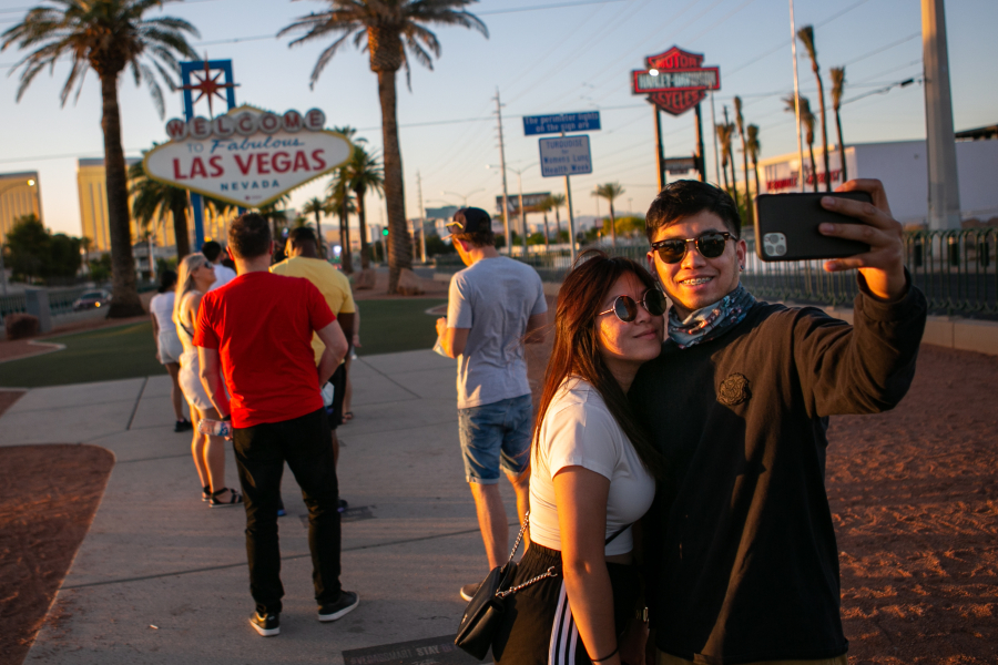 People stop to take photos at the iconic Welcome to Las Vegas sign on May 12, 2021 in Las Vegas.