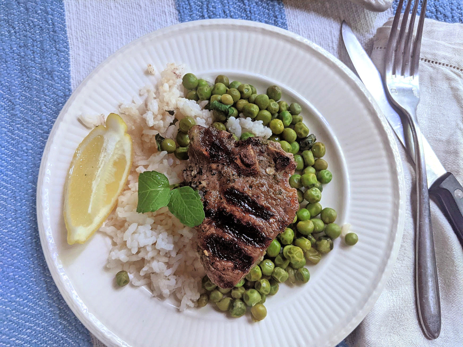 Lamb cooks quickly on the grill, and pairs well with a minty pea salad.