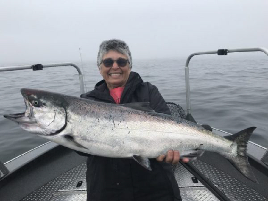 A fine Chinook taken in the ocean while fishing with Bob Rees brings a smile to the face of this lucky angler. The early one-week Chinook fishery was slow, but the fishing should pick up once the recent heat wave abates.